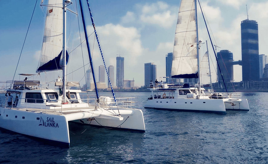 Luxury leisure boat cruising along Sri Lanka&rsquo;s coastline, showcasing traditional boat-building craftsmanship.