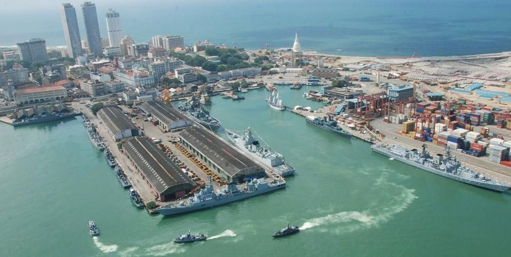 Aerial close up view of port with yachts in the sea