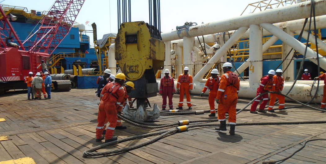 View of vessel crew preparing vessel for static tow tanker lifting