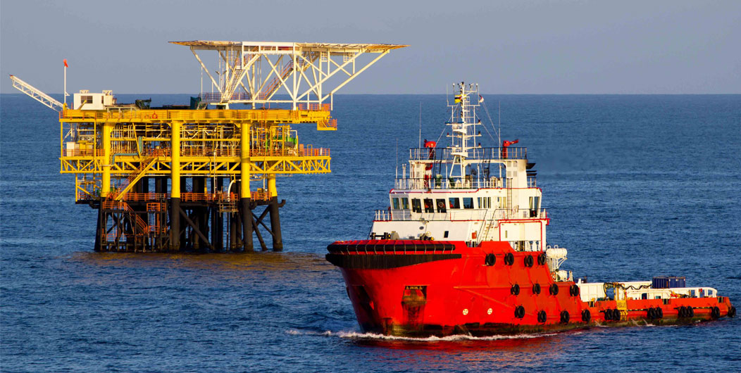 Boat is waiting transfer cargo and crews to platform